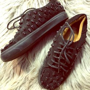 Jeffery Campbell scull studded sneakers.